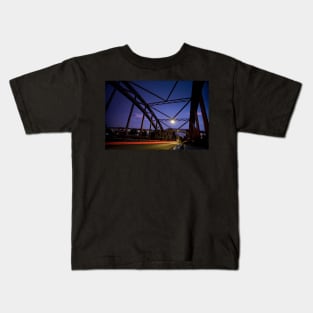 Perspective of an iron bridge with car light trails at twilight in Berlin, Germany Kids T-Shirt